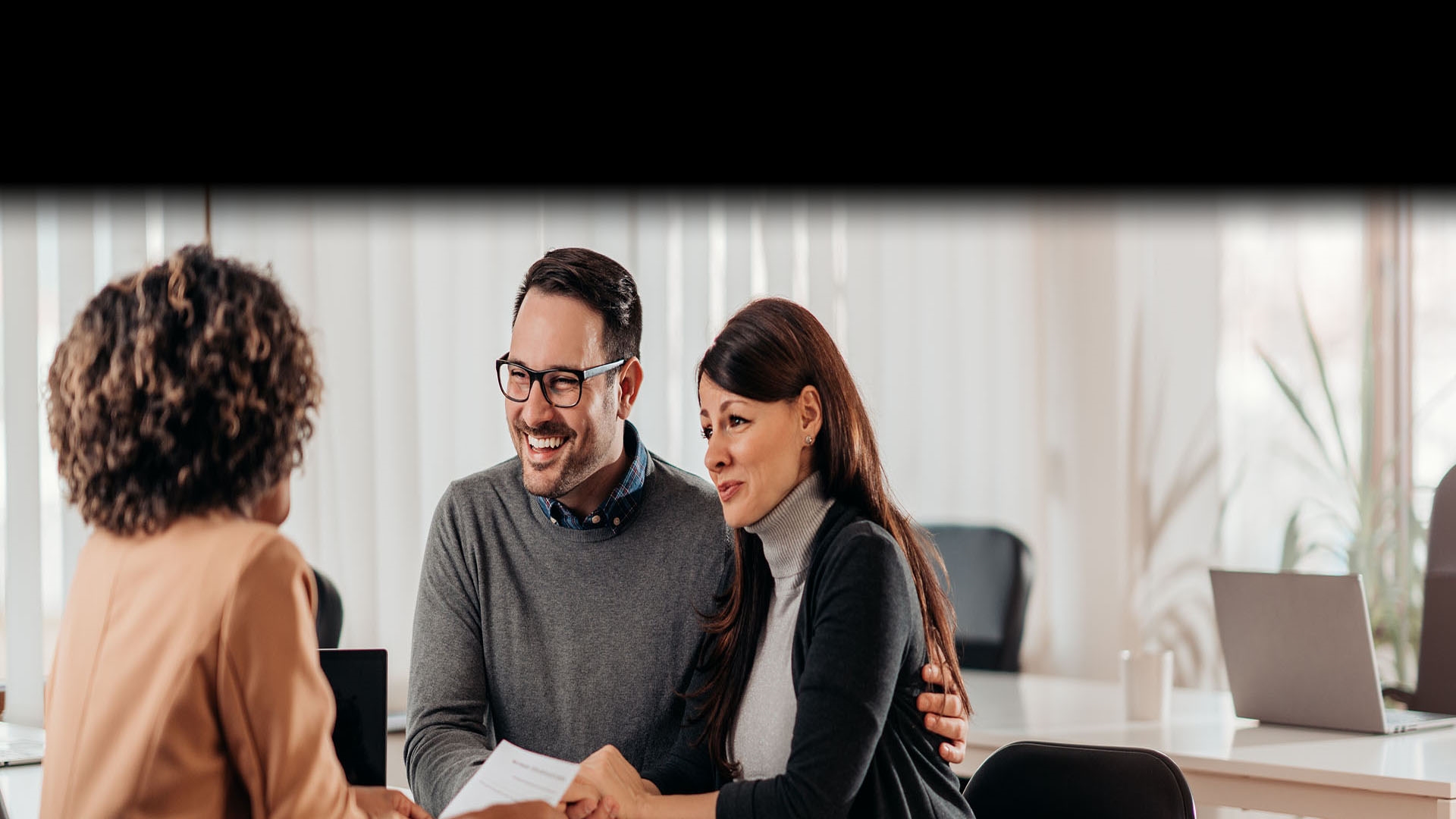 Couple consulting with a banking representative