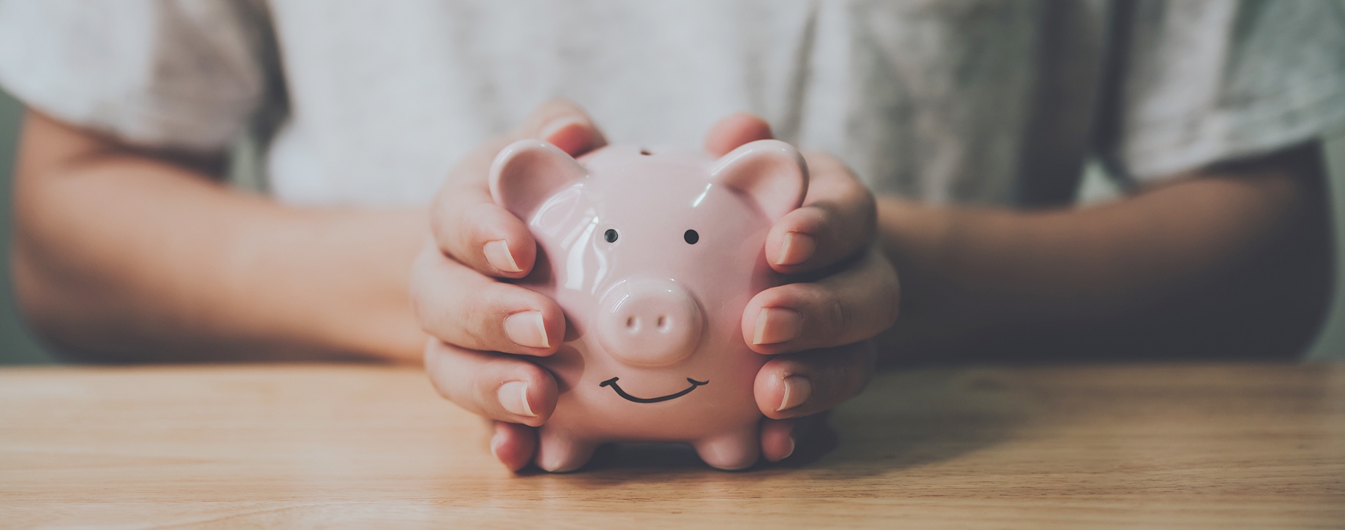 man holding a piggy bank