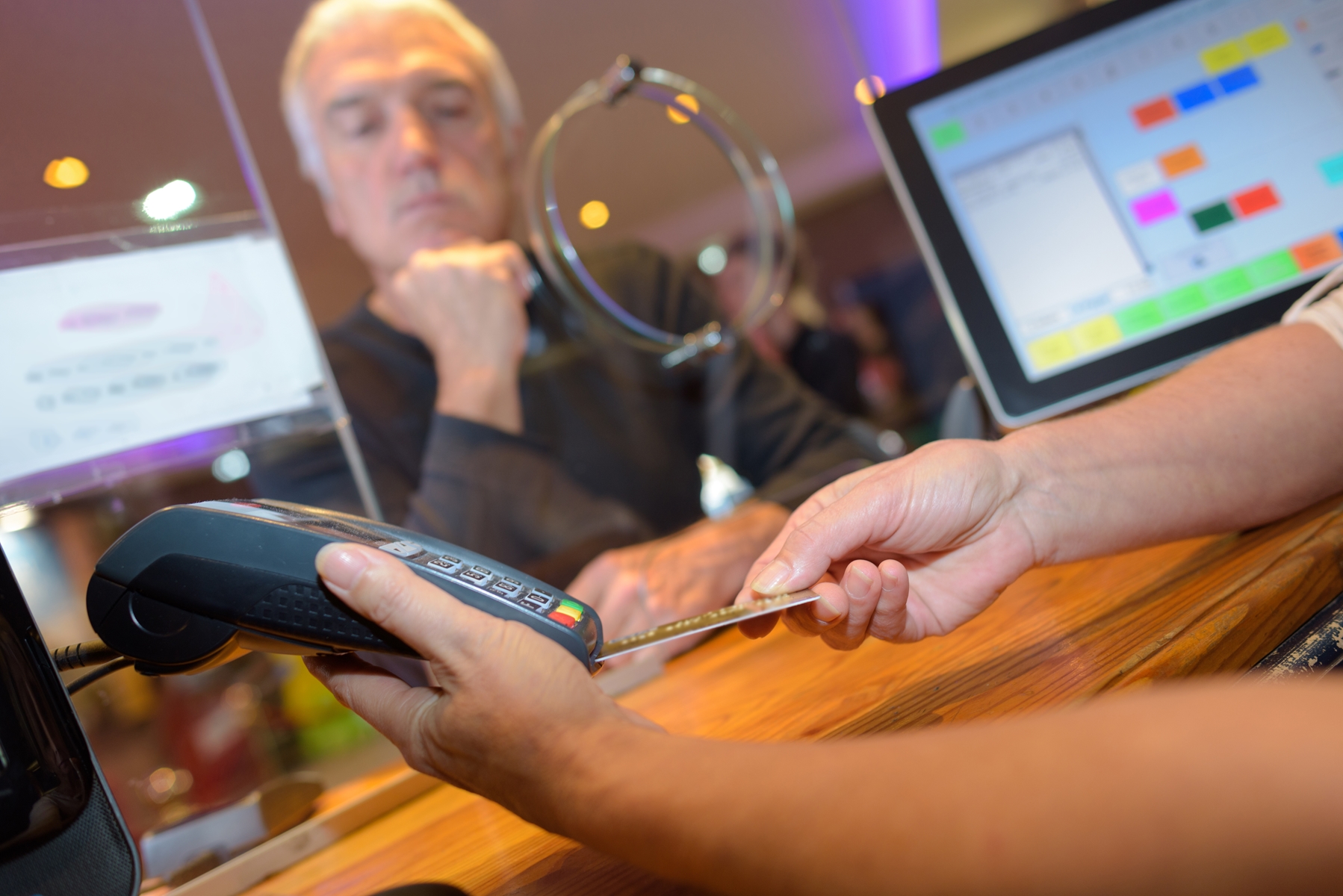 Man paying in bank